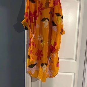 Floral sheer shirt, wrap around. Long in back shorter in  front.runs like large